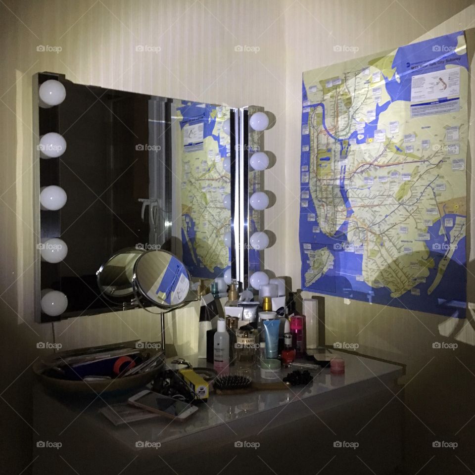 Room with make up mirror illuminated with flash light like a crime place 