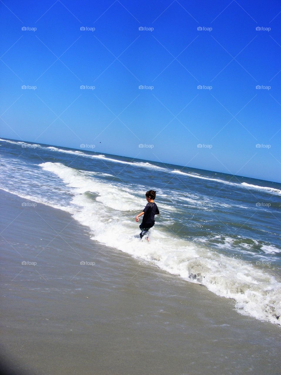 running through the waves