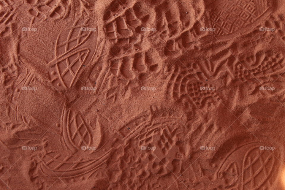 Shoe prints on red sand