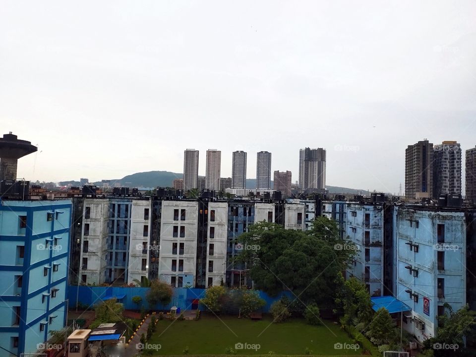 Architecture Of Human 
and Nature.

Multistorey Buildings 🏢
Mountains in Background