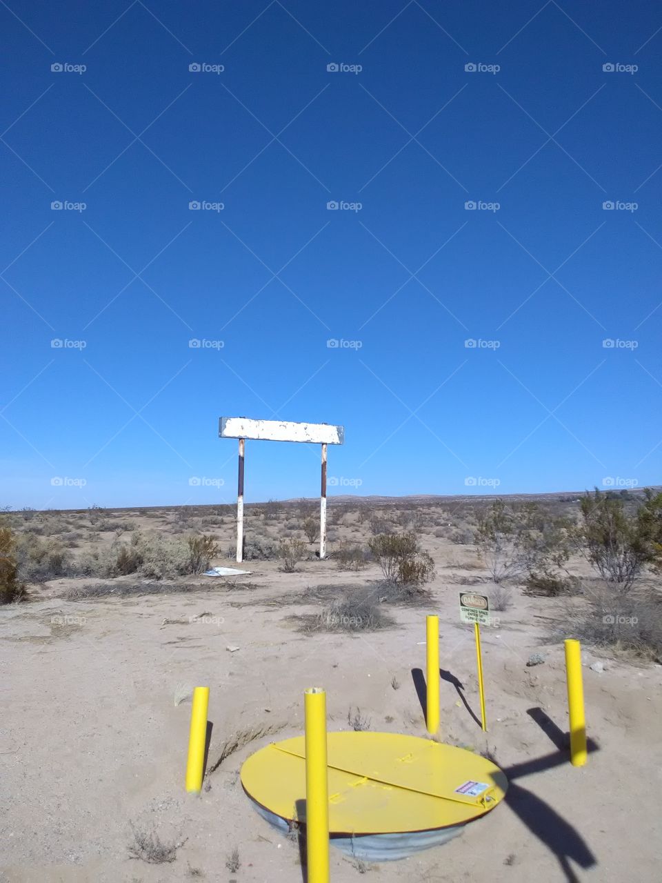rusty sign in the middle of deserts