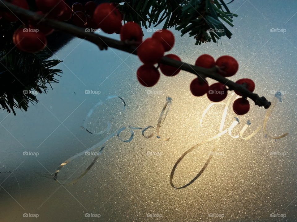 Text on wet glass with fruits