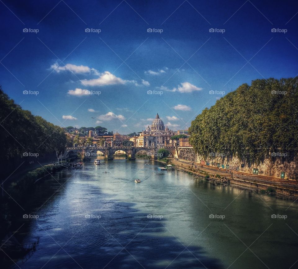 Saint Peter’s Basilica and Vatican City seen from a bridge over the Tiber River