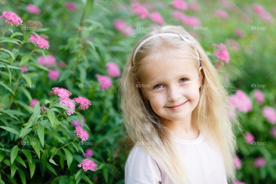 Portrait of little Caucasian girl with blonde hair