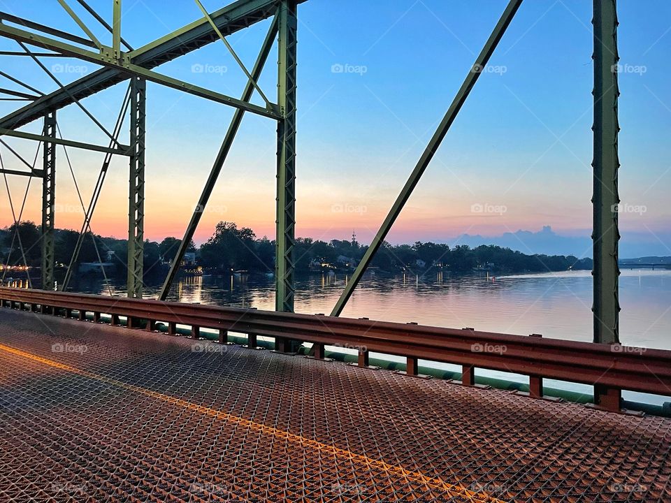 Walking across a bridge as the sunsets.. 