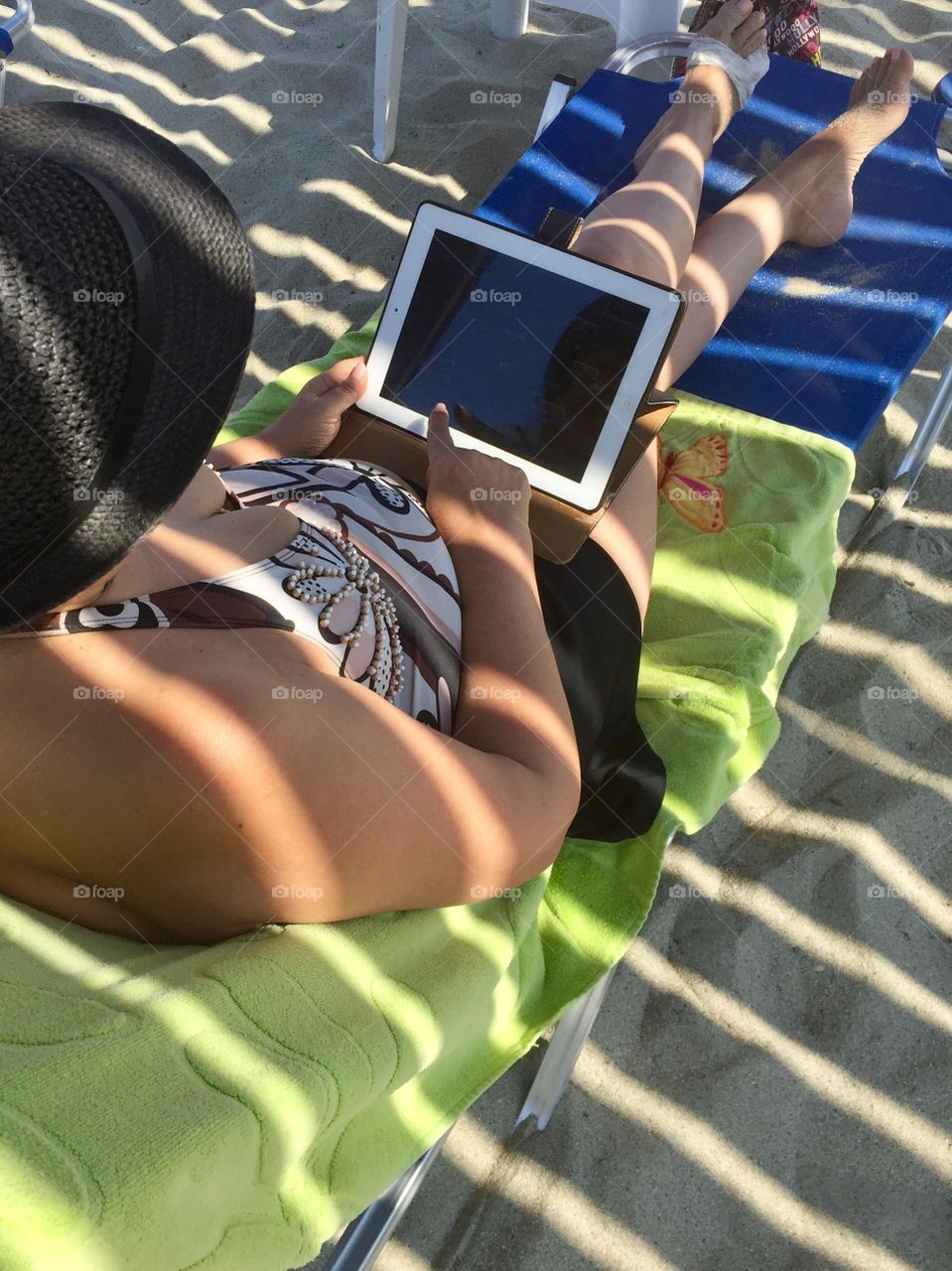 Woman at the beach under the shelter