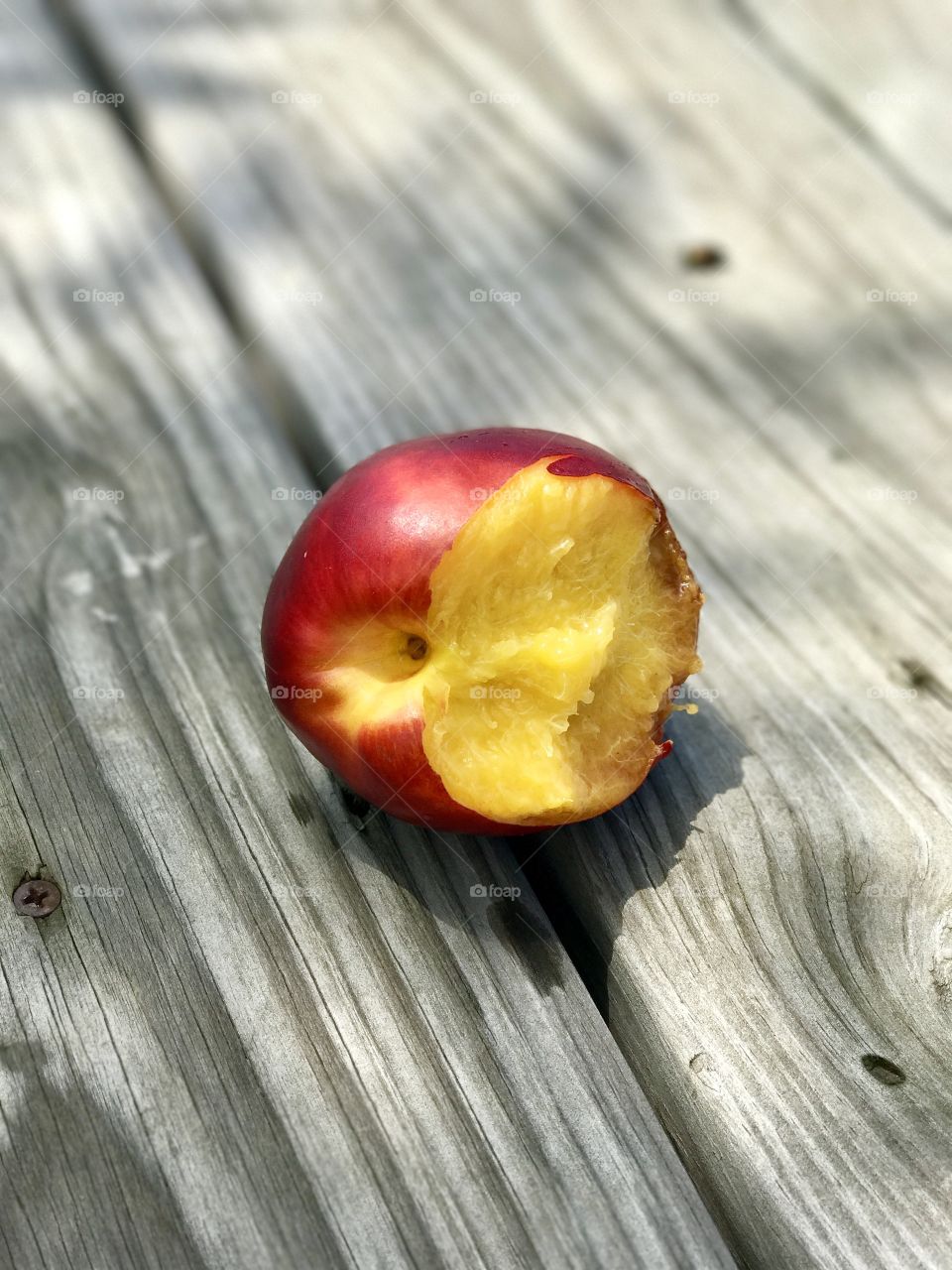 Single eaten apple