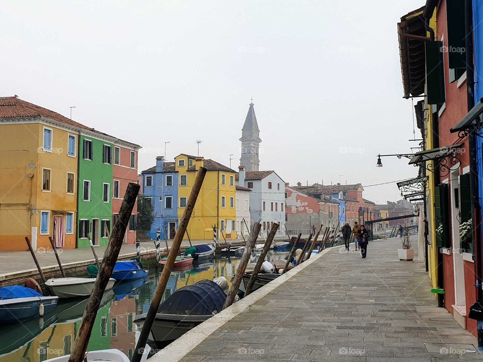 Burano island coloful homes canal side.