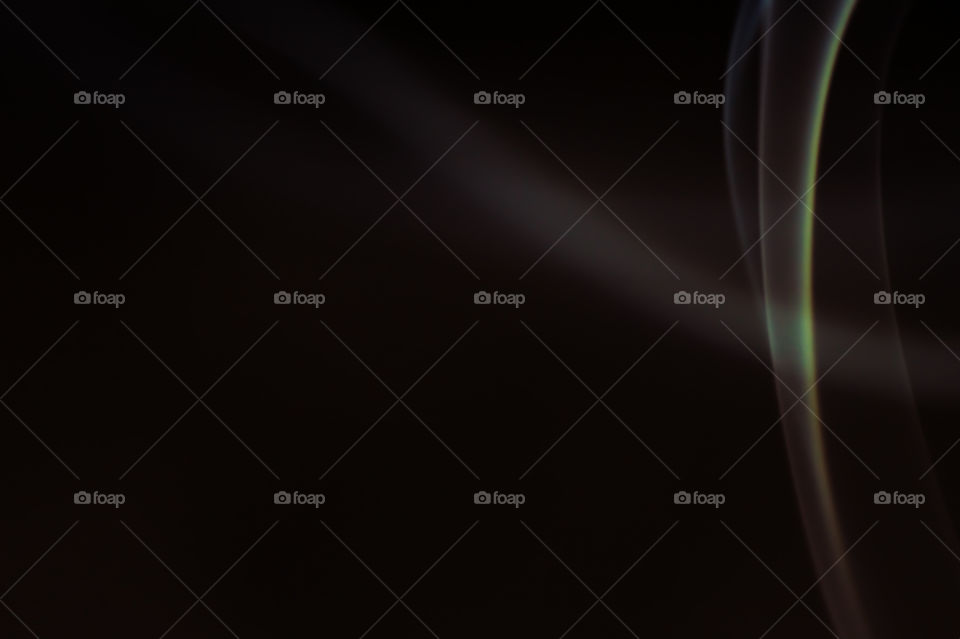 Smoke scented candles on a black background