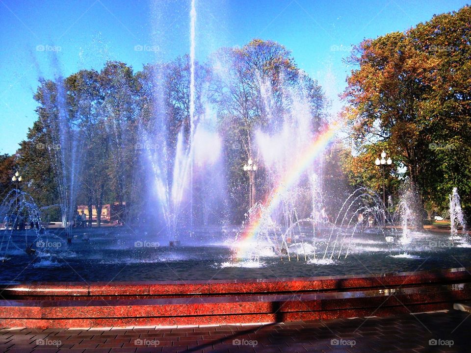 the rainbow in the city's fountain.