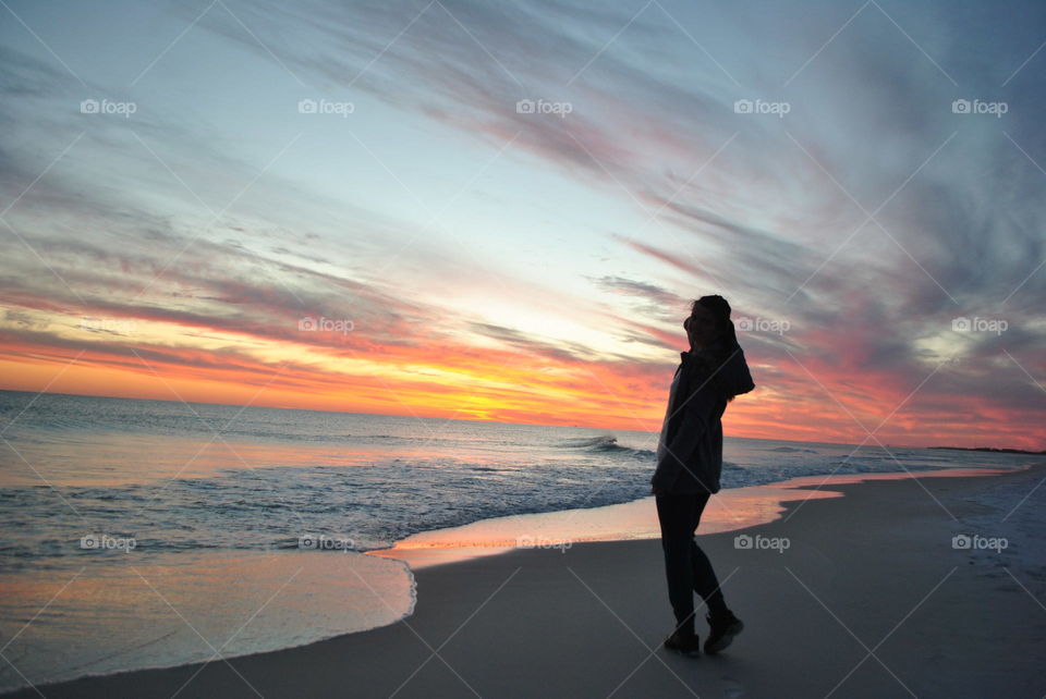 Girl, beach and sunset