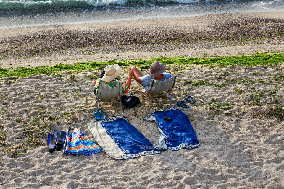 Summer time. Sunbathing and relaxing on the beach