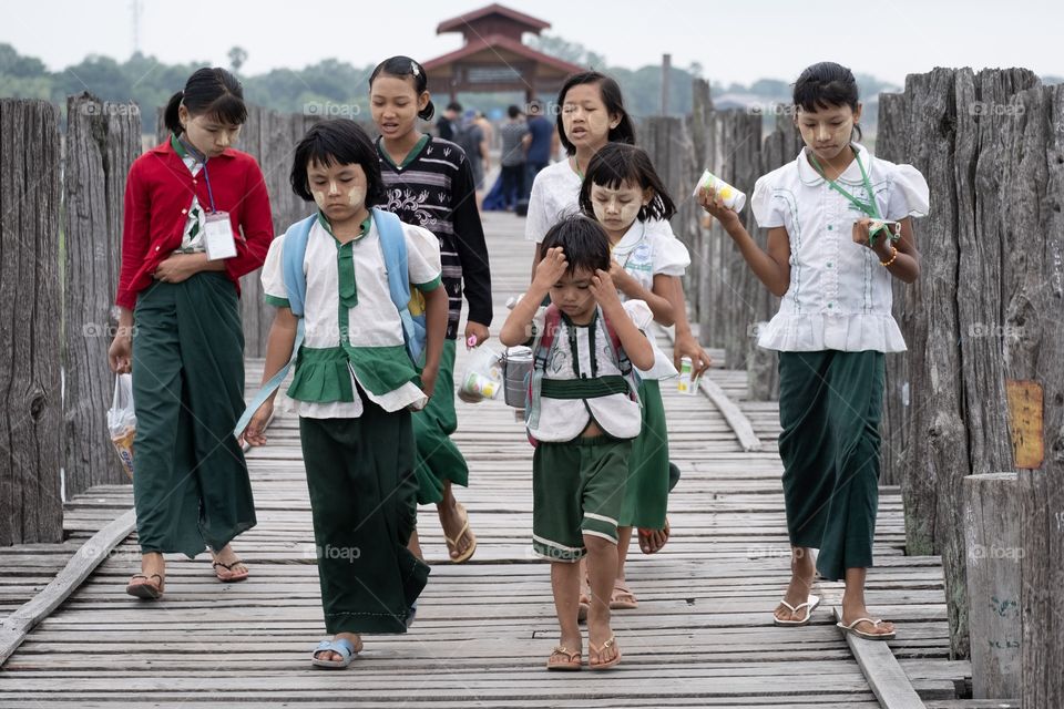 Myanmar Local life style , student go to school in the morning at U being bridge , the most longest wooden bridge in the world