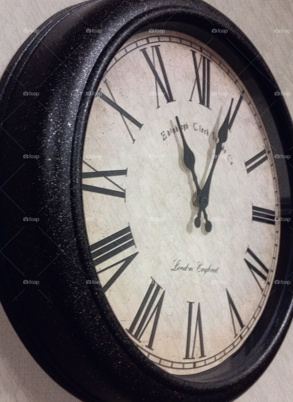 Old-fashioned clocks on wall