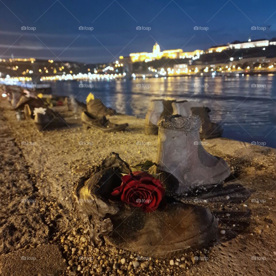 the shoes from the bank of the Danube and a red rose as a tribute to the victims of the holocaust, Budapest, Hungary