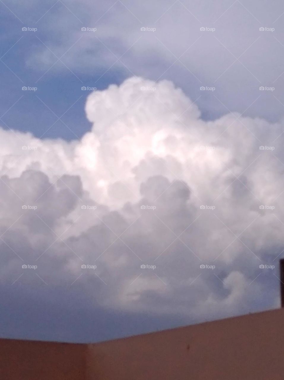 a rainy day, white clouds whites shining slightly blue sky whitish cloud scattered, slightly rainy very beautiful