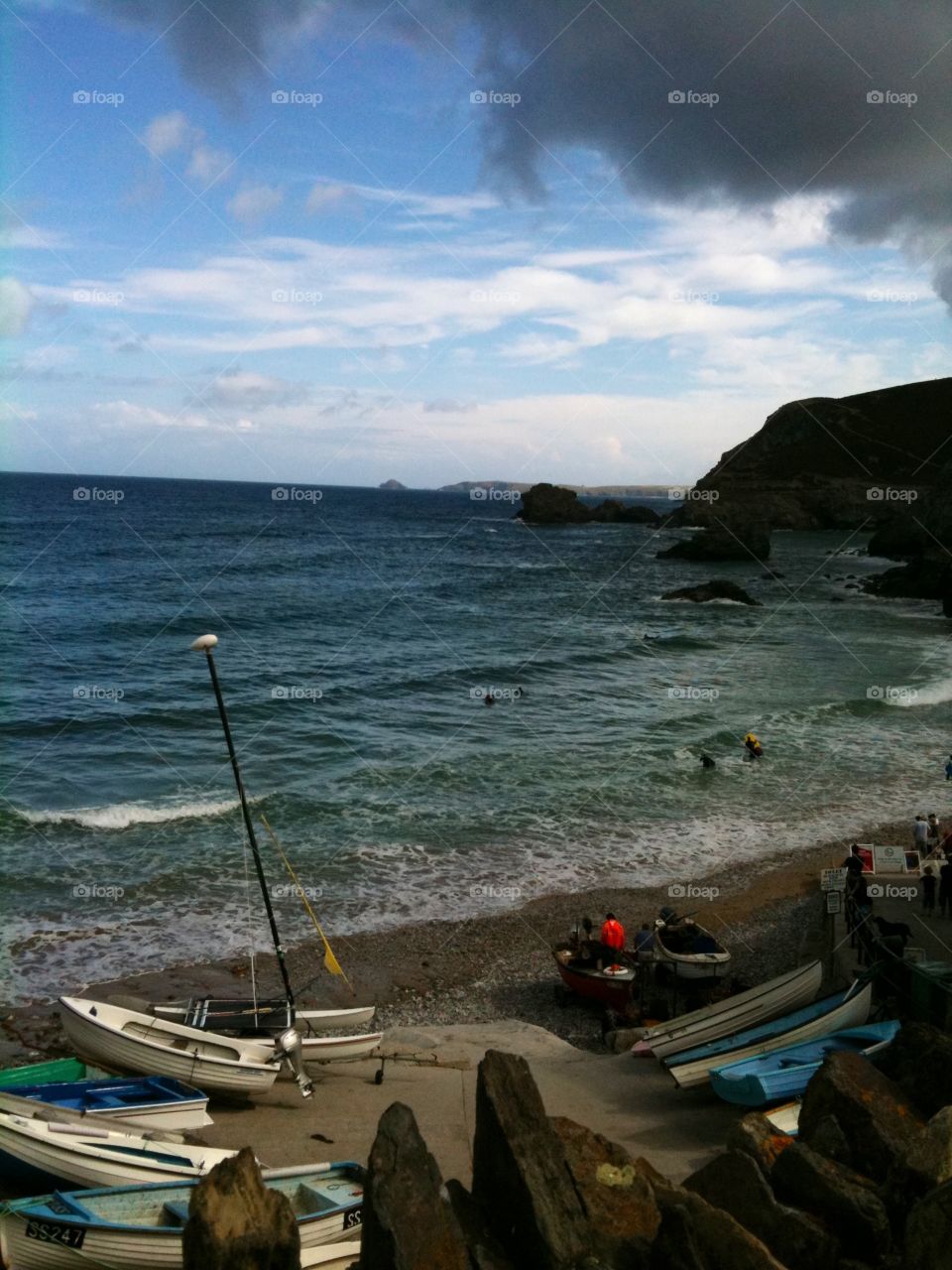 A dark cloud creeps in. Devon shingle beach. No fishing today looks like rain is coming. 
