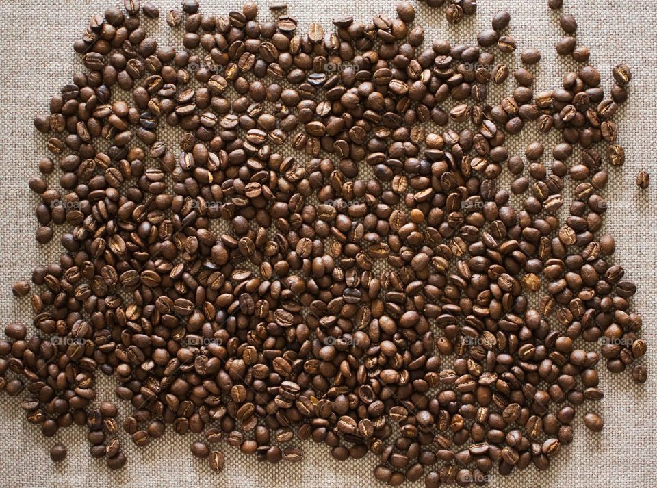 Coffee Beans On A Textile Background