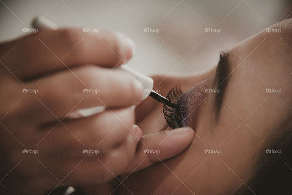 A face makeup processing on Asian female, closeup on eyelashes