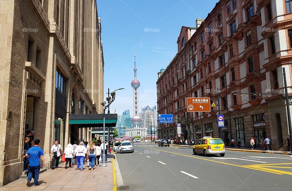 Oriental Pearl Tower seen from Nanjing East Road, Shanghai, China.