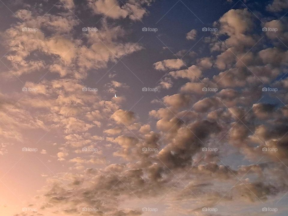 The evening clouds carrying away the moon. #babymoon lost in the sky