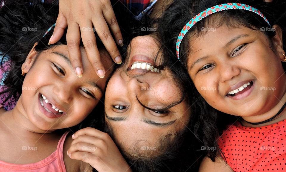 smiles of mother and daughters