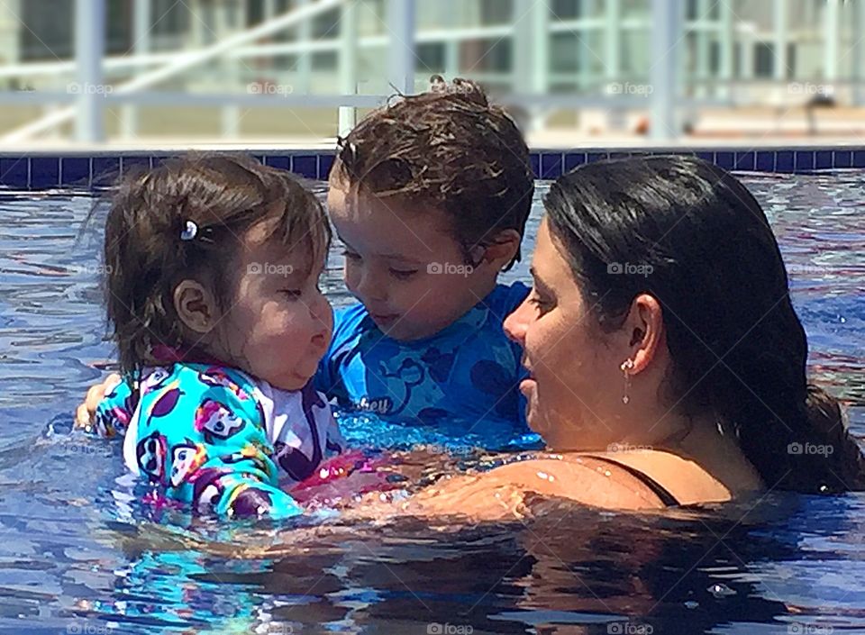 Mother and sons in the pool