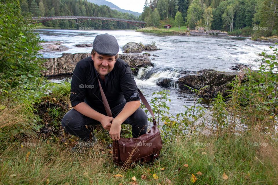 A Man by the river ,a relax trip after work. Its cozy and amazing way to spend a few hours .