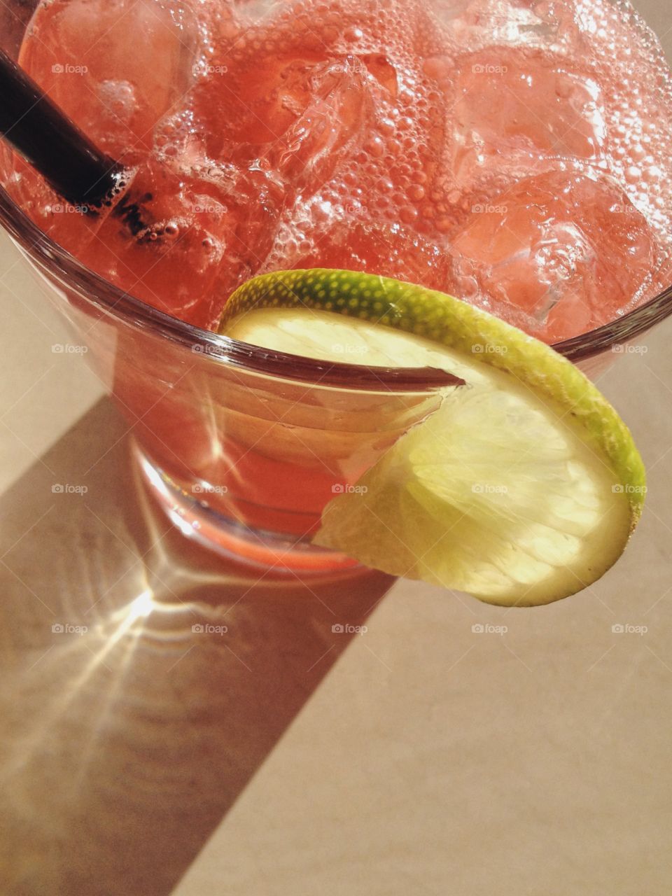 Watermelon margarita with a fresh lime slice 