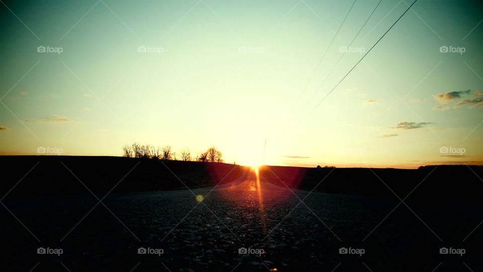 Sunset in the road