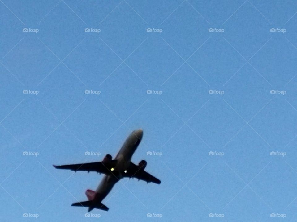 Beautiful airplane flying cross the sky