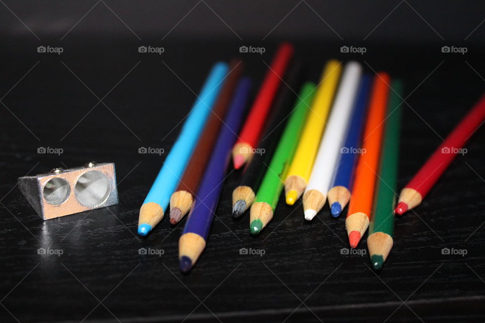 colored pencils and sharpener