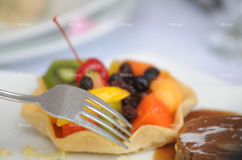 Fruit dessert with fork decorated table