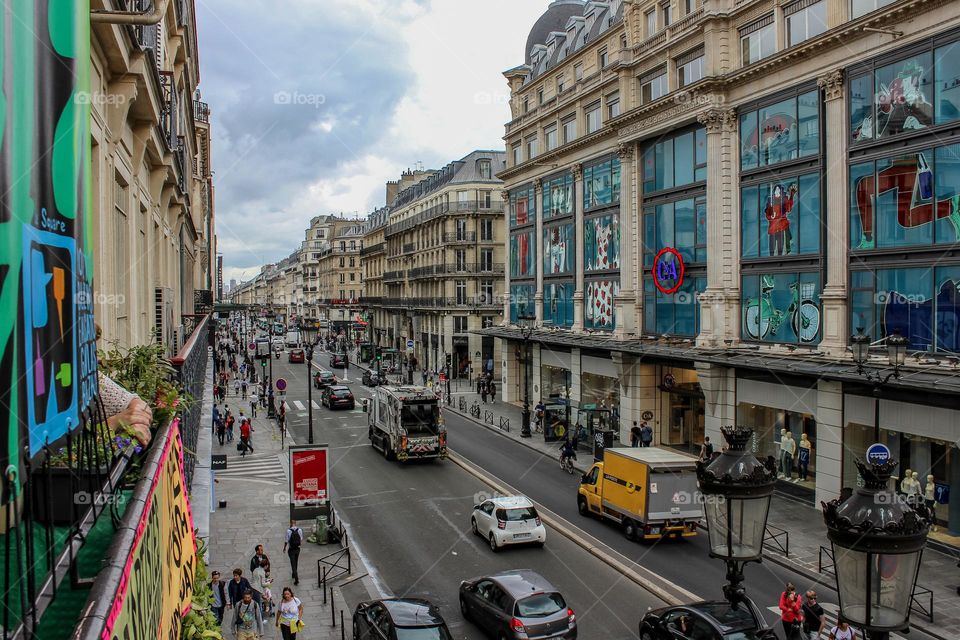 Car traffic. A view of the street of Paris from the window of the second floor.