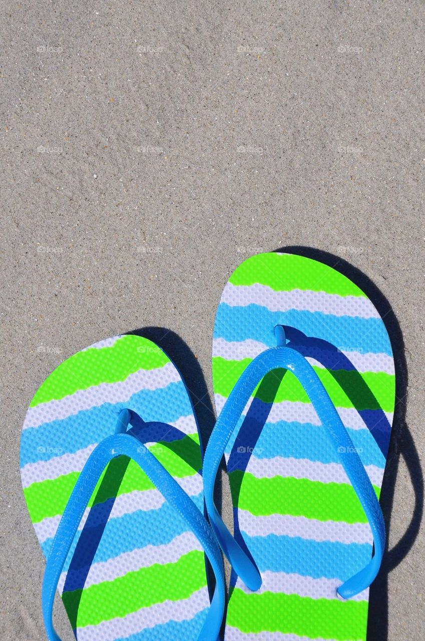 Flip flops on the sand