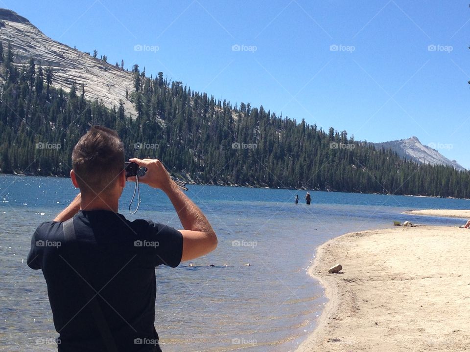 Adult takes Photo of the river