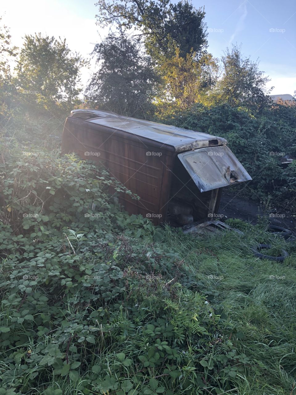 Burnt out rolled van