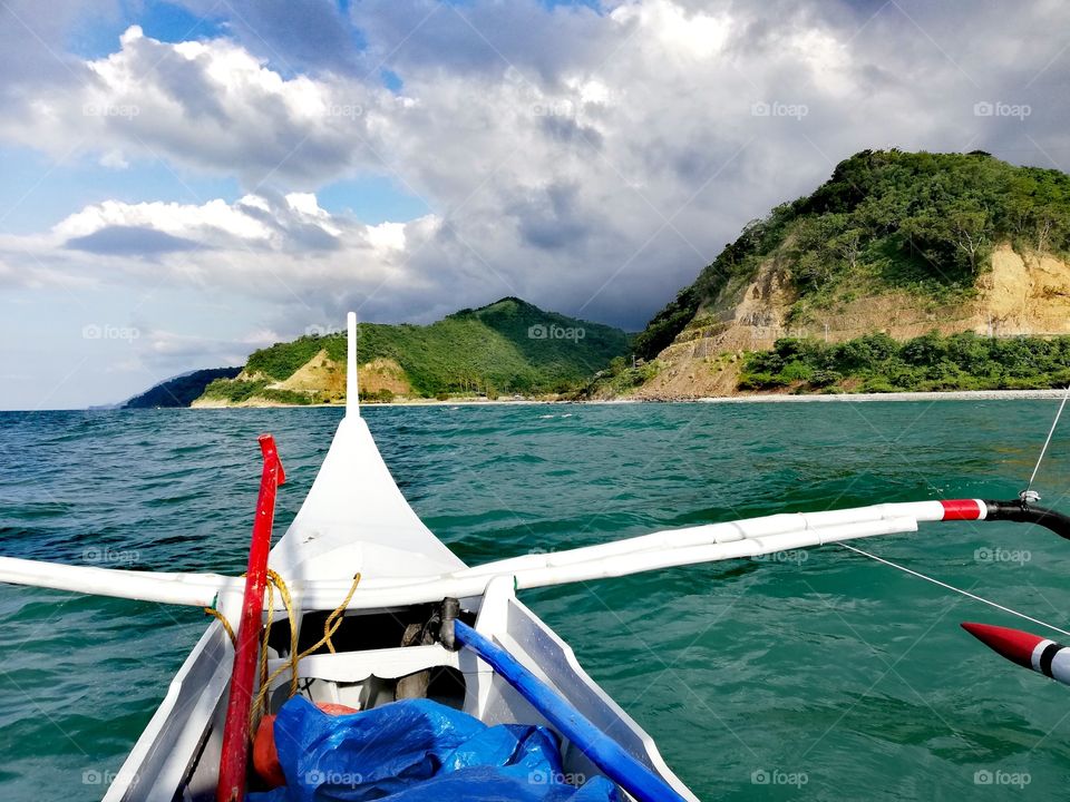 Traveling the South Chinese Sea by banka to remote part of Abra de Ilog on Mindoro, Island of Philippines