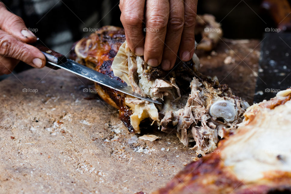 cutting roasted Lamb