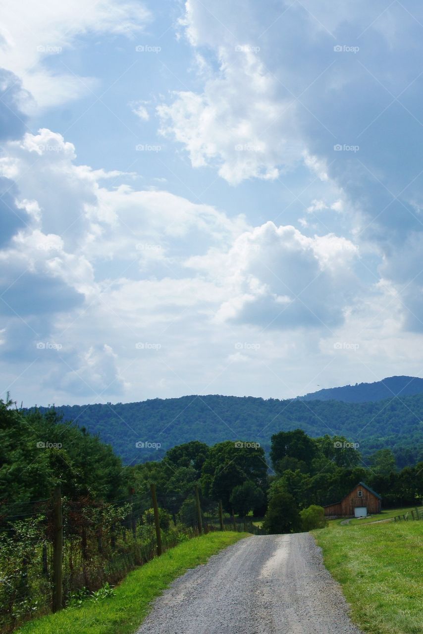 View of a road against cloudy sky