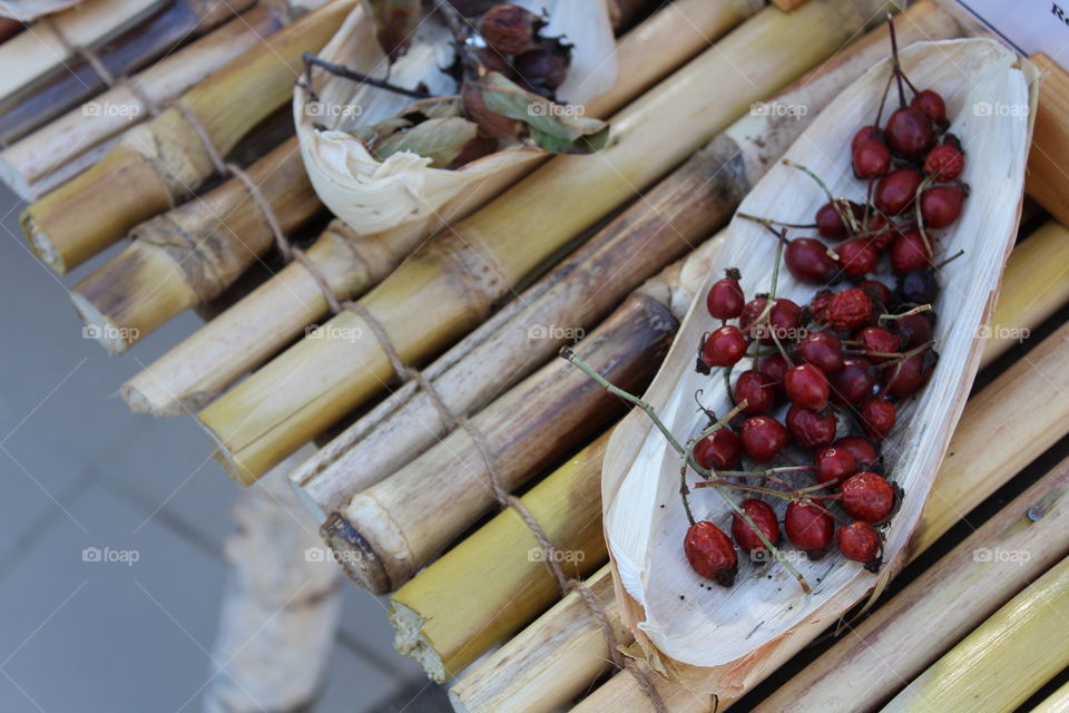 beautiful red berries on a bamboo table