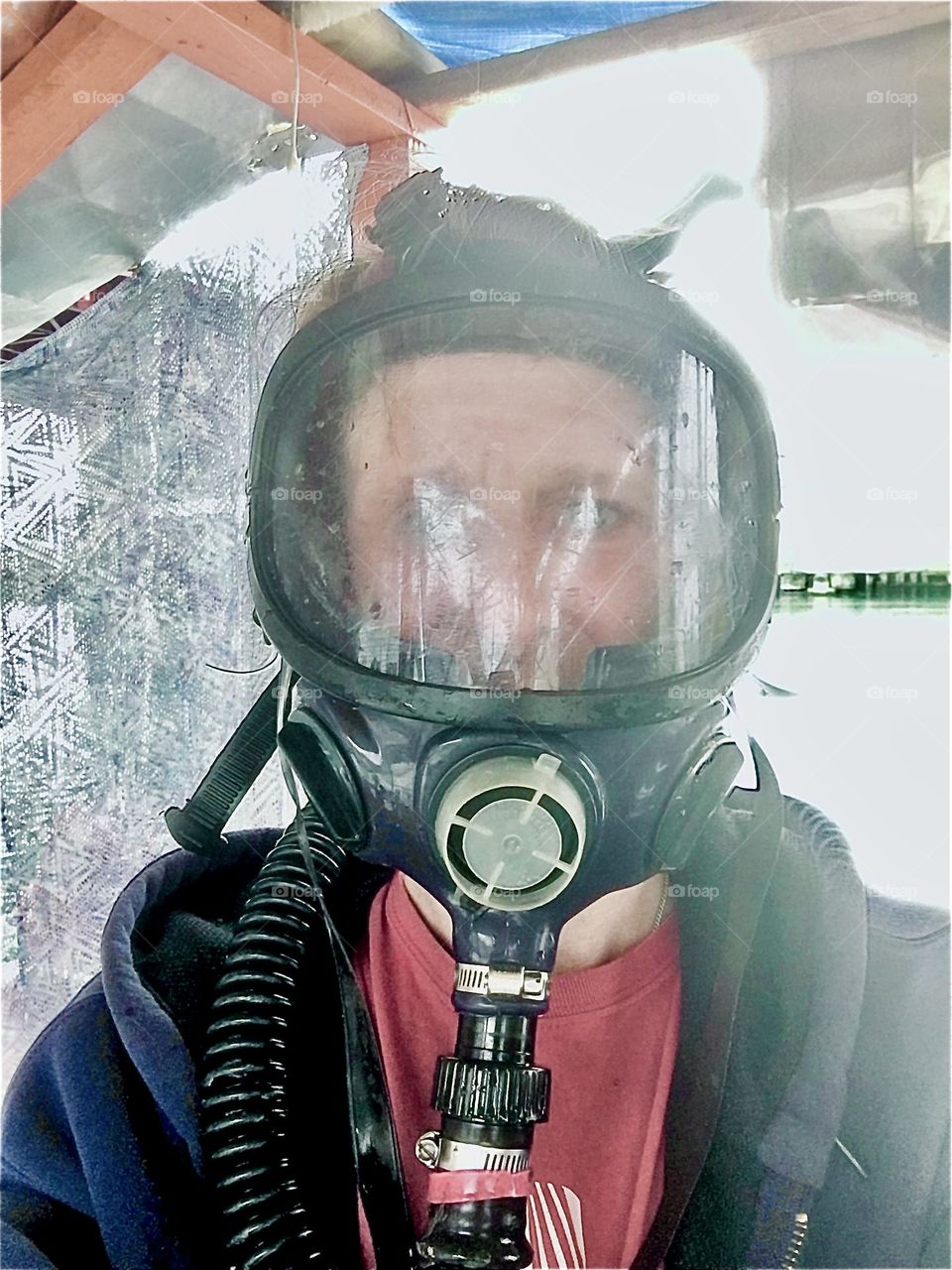 Timothy Trespas is wearing protective face gear for some of the maintenance work that needs to be done on a boat, fiberglassing, painting, polyurethaneing, cleaning up all sorts of messes … 2019. Hypnotic Productions