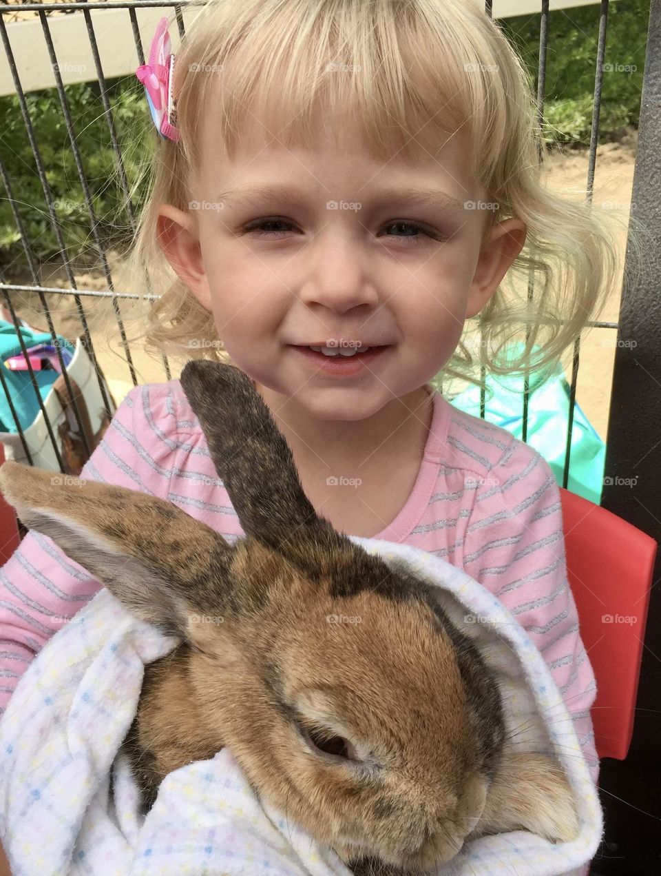 Sweet little girl and big bunny 