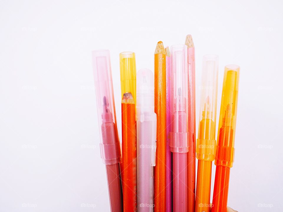 Bright colorful pencils and pens
