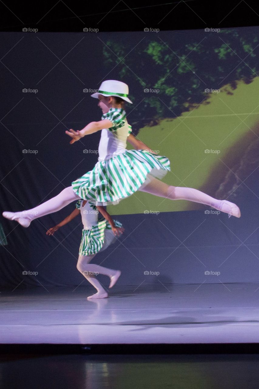 Girl jumping during a dance performance