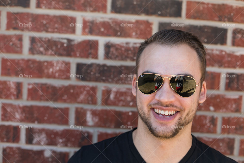 Portrait of a happy man in sunglasses