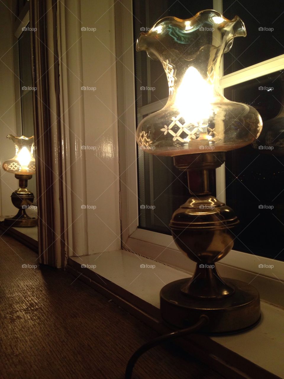 Lamps in the window of a country inn