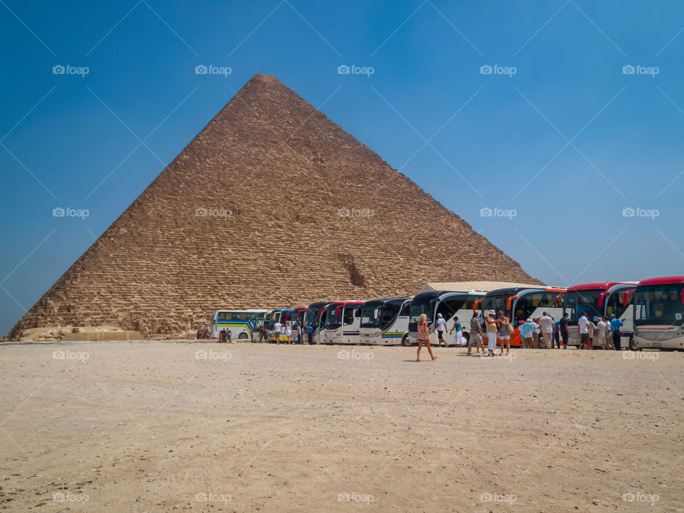 Tourists sightseeing the Great Pyramid in Egypt.