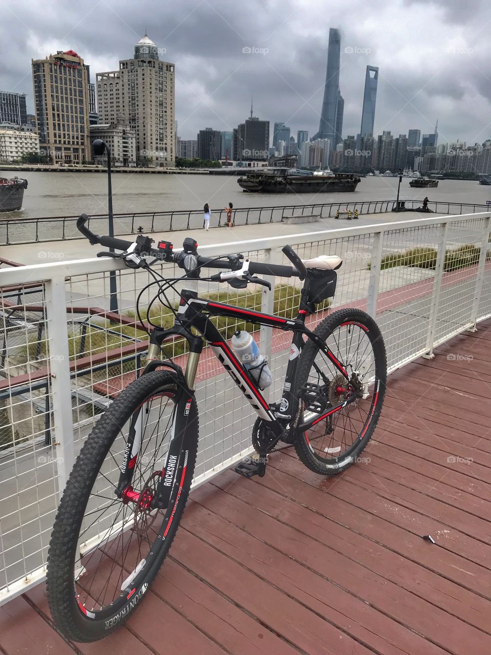 Mountain bike ride through a modern mega city - Shanghai Huangpu river park morning bike ride