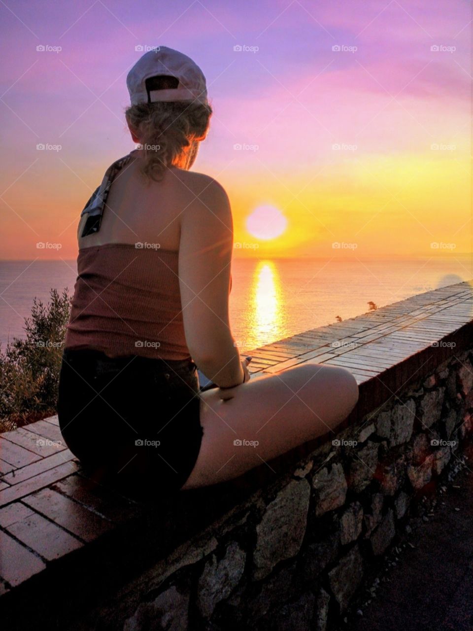 a girl with a beautiful sunset